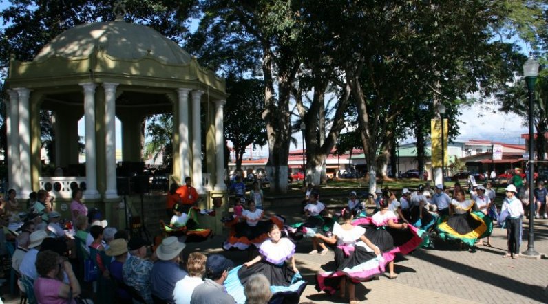 Local children of Esparza, Costa Rica dance in the town square